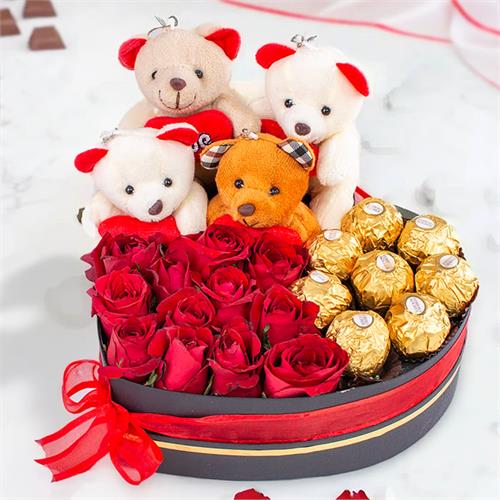 Loves Sweet Embrace Box Arranged With 12 Fresh Red Roses And 8 Ferrero Chocolates With Tiny Teddies