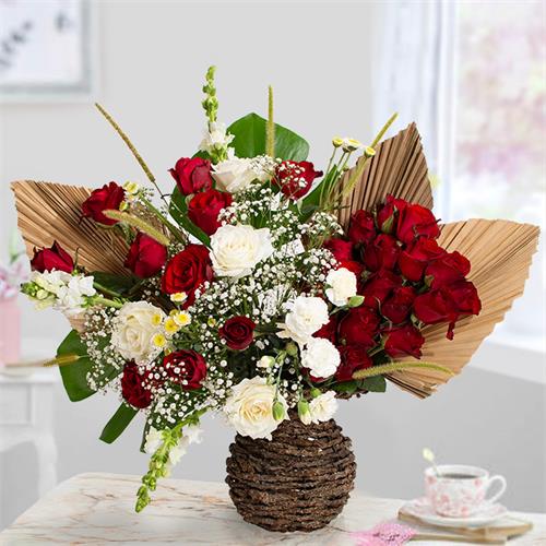 Pure Elegance Premium Flower Arrangement In A Woven Vase