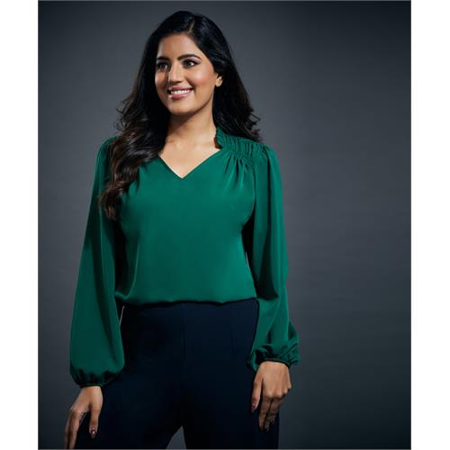 Side smocking done solid green top